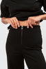 Trousers with exposed zip